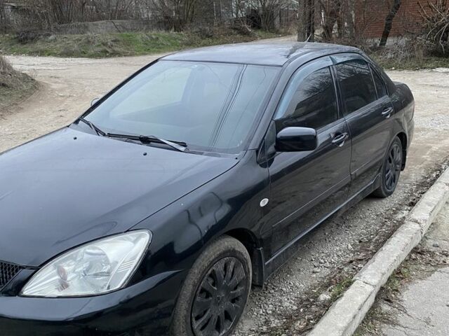 Чорний Міцубісі Lancer, об'ємом двигуна 1.6 л та пробігом 250 тис. км за 3500 $, фото 8 на Automoto.ua