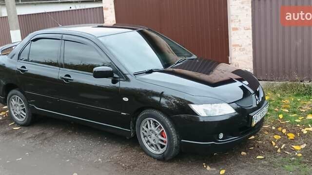 Черный Мицубиси Лансер, объемом двигателя 1.58 л и пробегом 261 тыс. км за 4400 $, фото 2 на Automoto.ua