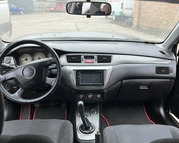 Чорний Міцубісі Lancer, об'ємом двигуна 1.58 л та пробігом 360 тис. км за 1500 $, фото 9 на Automoto.ua