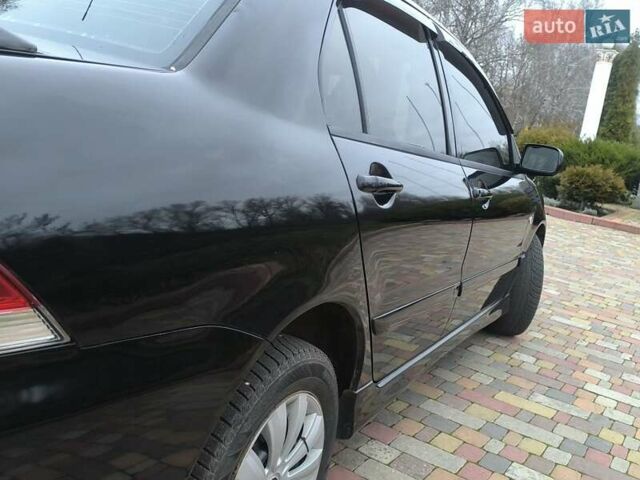 Чорний Міцубісі Lancer, об'ємом двигуна 1.58 л та пробігом 263 тис. км за 4500 $, фото 11 на Automoto.ua