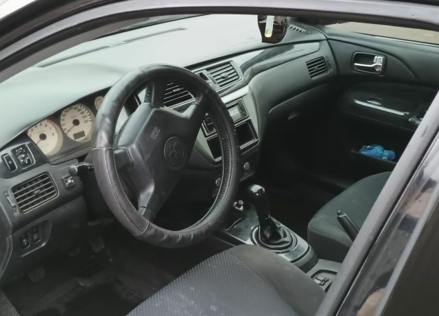 Чорний Міцубісі Lancer, об'ємом двигуна 1.6 л та пробігом 261 тис. км за 4400 $, фото 7 на Automoto.ua