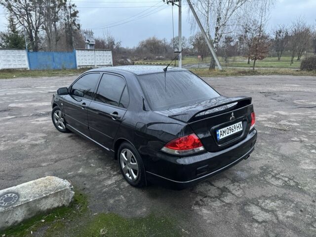 Чорний Міцубісі Lancer, об'ємом двигуна 1.6 л та пробігом 154 тис. км за 5500 $, фото 9 на Automoto.ua