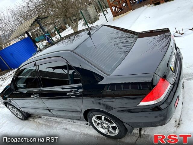 Чорний Міцубісі Lancer, об'ємом двигуна 1.6 л та пробігом 212 тис. км за 5200 $, фото 1 на Automoto.ua