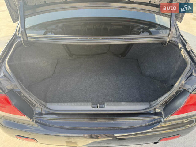 Чорний Міцубісі Lancer, об'ємом двигуна 1.6 л та пробігом 205 тис. км за 3650 $, фото 13 на Automoto.ua