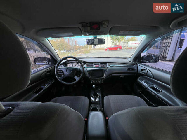 Чорний Міцубісі Lancer, об'ємом двигуна 1.58 л та пробігом 364 тис. км за 4000 $, фото 13 на Automoto.ua
