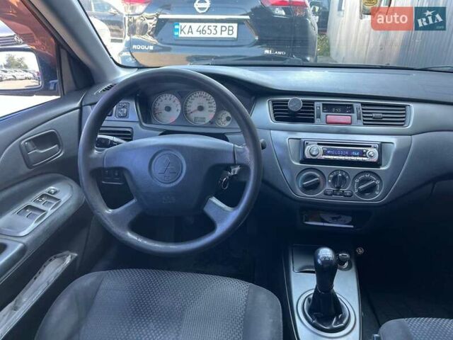 Черный Мицубиси Лансер, объемом двигателя 1.58 л и пробегом 310 тыс. км за 5690 $, фото 13 на Automoto.ua