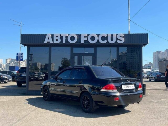 Чорний Міцубісі Lancer, об'ємом двигуна 2 л та пробігом 310 тис. км за 4990 $, фото 4 на Automoto.ua