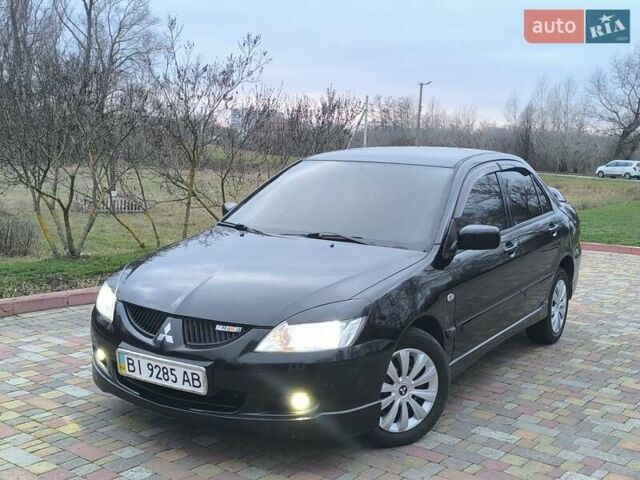 Чорний Міцубісі Lancer, об'ємом двигуна 1.58 л та пробігом 263 тис. км за 4500 $, фото 23 на Automoto.ua