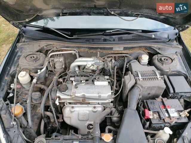 Чорний Міцубісі Lancer, об'ємом двигуна 1.58 л та пробігом 210 тис. км за 2999 $, фото 20 на Automoto.ua