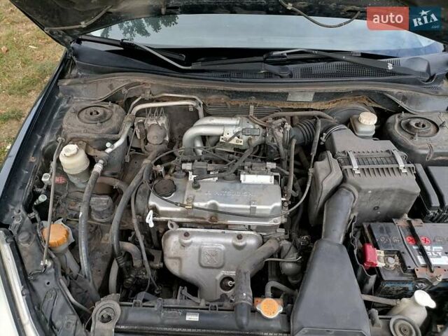 Чорний Міцубісі Lancer, об'ємом двигуна 1.58 л та пробігом 210 тис. км за 2999 $, фото 19 на Automoto.ua