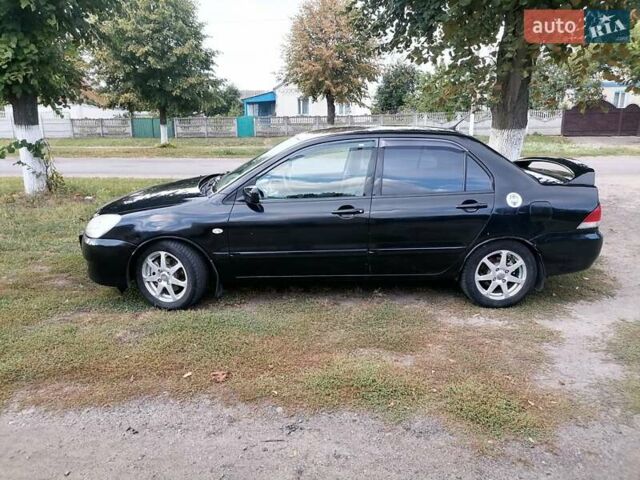 Чорний Міцубісі Lancer, об'ємом двигуна 1.58 л та пробігом 210 тис. км за 2999 $, фото 3 на Automoto.ua
