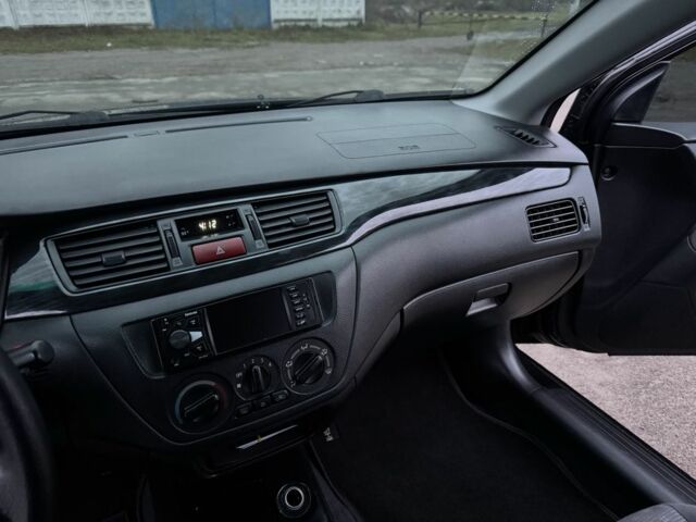 Чорний Міцубісі Lancer, об'ємом двигуна 1.6 л та пробігом 154 тис. км за 5500 $, фото 21 на Automoto.ua