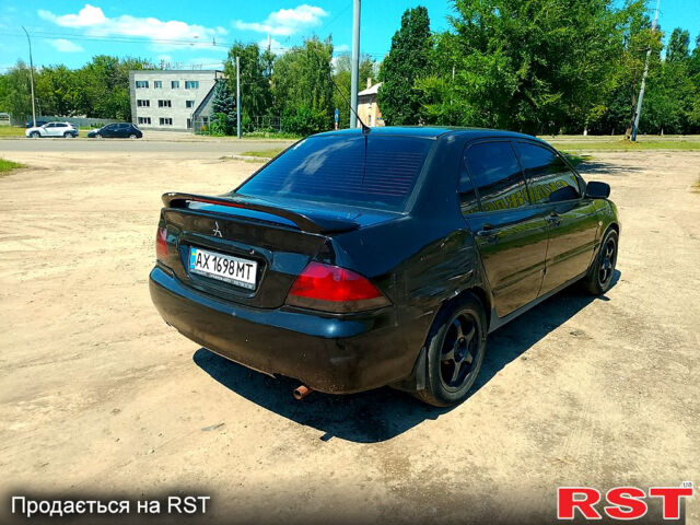 Черный Мицубиси Лансер, объемом двигателя 1.6 л и пробегом 230 тыс. км за 2650 $, фото 3 на Automoto.ua