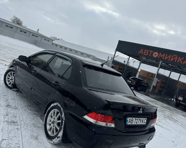 Чорний Міцубісі Lancer, об'ємом двигуна 1.58 л та пробігом 340 тис. км за 3550 $, фото 21 на Automoto.ua