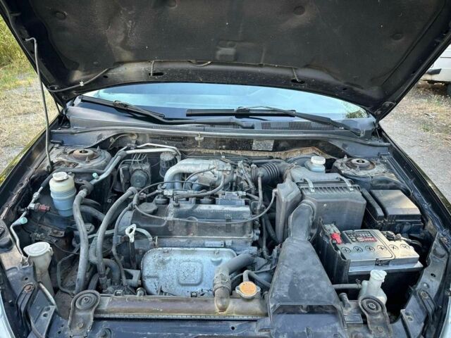 Черный Мицубиси Лансер, объемом двигателя 1.6 л и пробегом 289 тыс. км за 3200 $, фото 16 на Automoto.ua