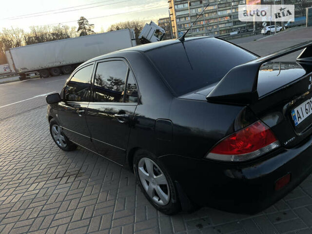 Чорний Міцубісі Lancer, об'ємом двигуна 1.58 л та пробігом 256 тис. км за 5350 $, фото 2 на Automoto.ua
