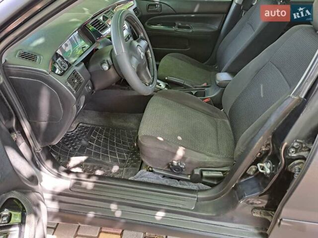 Чорний Міцубісі Lancer, об'ємом двигуна 1.58 л та пробігом 280 тис. км за 3950 $, фото 14 на Automoto.ua