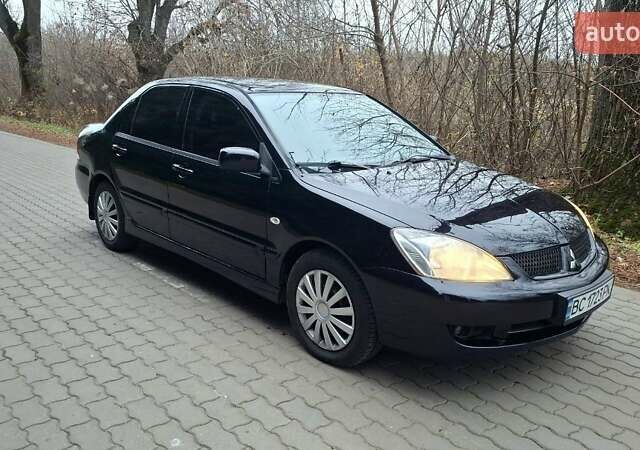 Черный Мицубиси Лансер, объемом двигателя 1.58 л и пробегом 246 тыс. км за 4200 $, фото 8 на Automoto.ua