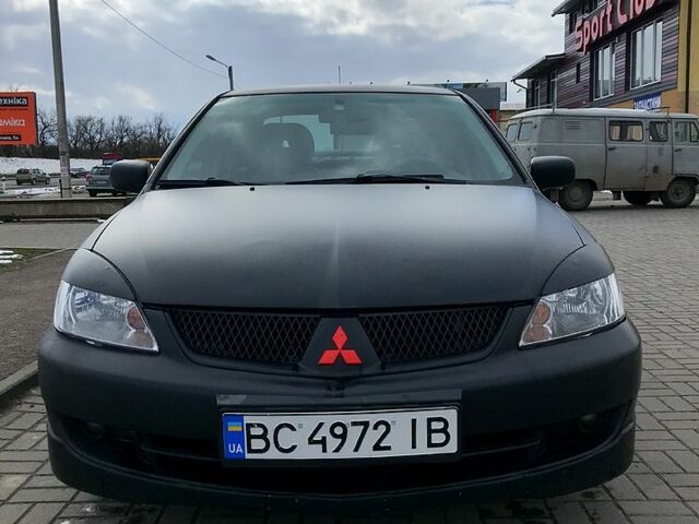 Чорний Міцубісі Lancer, об'ємом двигуна 2 л та пробігом 270 тис. км за 4499 $, фото 2 на Automoto.ua