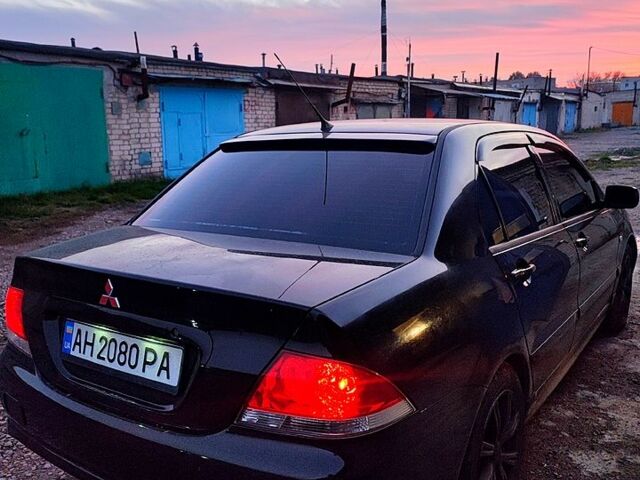 Черный Мицубиси Лансер, объемом двигателя 1.6 л и пробегом 240 тыс. км за 3900 $, фото 4 на Automoto.ua