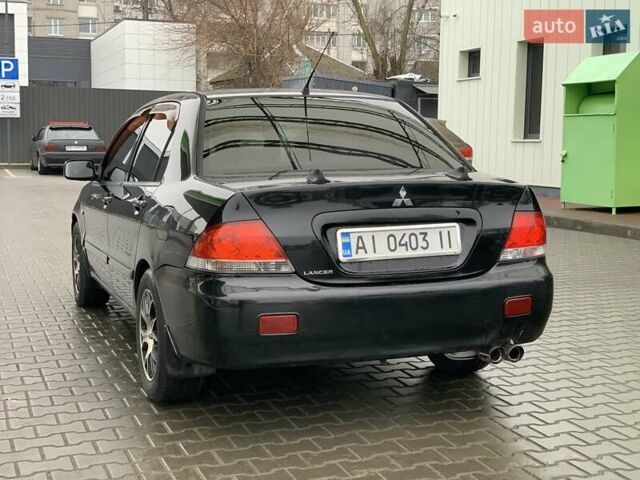 Чорний Міцубісі Lancer, об'ємом двигуна 1.58 л та пробігом 270 тис. км за 3950 $, фото 2 на Automoto.ua