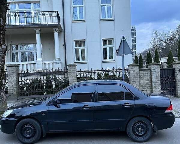 Черный Мицубиси Лансер, объемом двигателя 1.6 л и пробегом 306 тыс. км за 4800 $, фото 5 на Automoto.ua