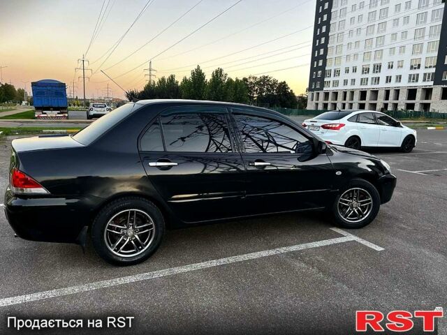 Чорний Міцубісі Lancer, об'ємом двигуна 1.6 л та пробігом 329 тис. км за 3500 $, фото 1 на Automoto.ua