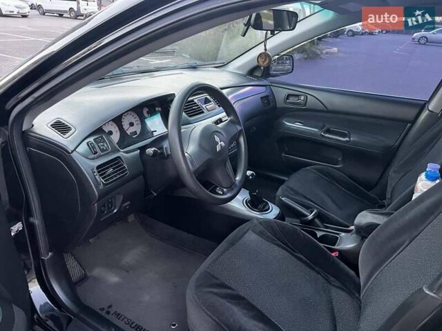 Чорний Міцубісі Lancer, об'ємом двигуна 1.58 л та пробігом 329 тис. км за 3500 $, фото 6 на Automoto.ua