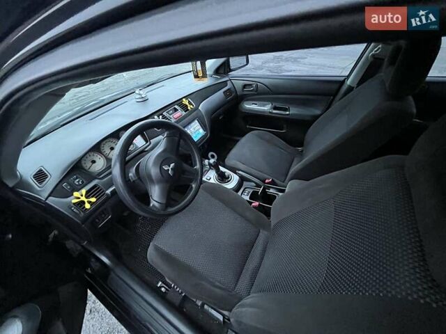 Чорний Міцубісі Lancer, об'ємом двигуна 1.58 л та пробігом 282 тис. км за 4100 $, фото 5 на Automoto.ua
