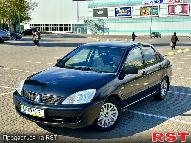 Черный Мицубиси Лансер, объемом двигателя 1.6 л и пробегом 208 тыс. км за 4999 $, фото 1 на Automoto.ua