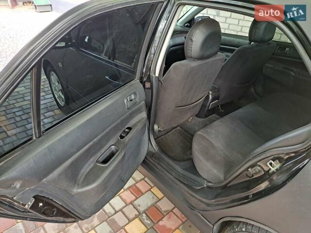 Чорний Міцубісі Lancer, об'ємом двигуна 1.58 л та пробігом 280 тис. км за 3950 $, фото 8 на Automoto.ua