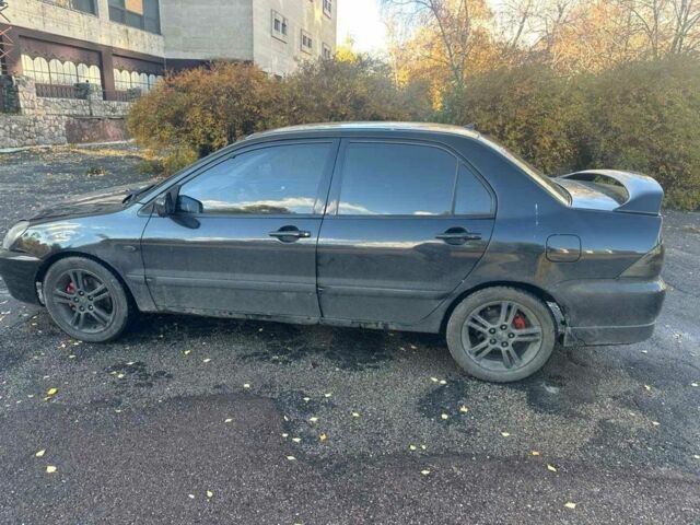 Черный Мицубиси Лансер, объемом двигателя 2 л и пробегом 200 тыс. км за 2999 $, фото 3 на Automoto.ua