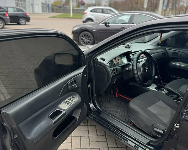 Черный Мицубиси Лансер, объемом двигателя 1.58 л и пробегом 370 тыс. км за 3500 $, фото 6 на Automoto.ua