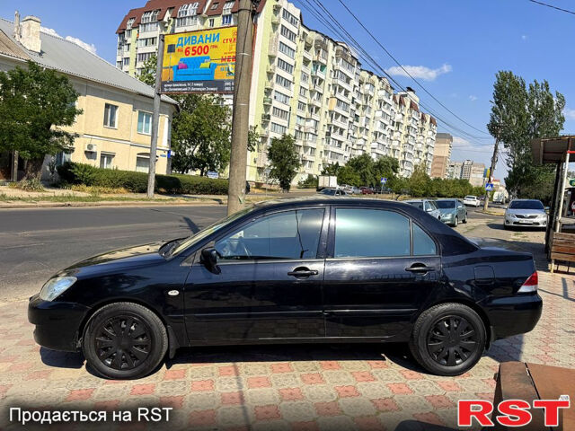 Черный Мицубиси Лансер, объемом двигателя 1.6 л и пробегом 300 тыс. км за 3599 $, фото 5 на Automoto.ua