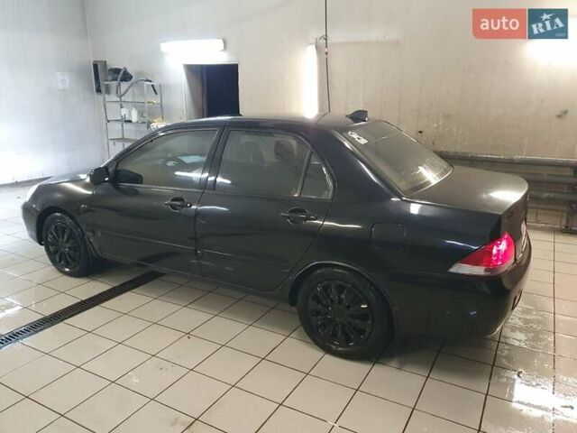 Чорний Міцубісі Lancer, об'ємом двигуна 1.58 л та пробігом 222 тис. км за 2999 $, фото 4 на Automoto.ua