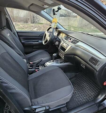Чорний Міцубісі Lancer, об'ємом двигуна 1.6 л та пробігом 350 тис. км за 4950 $, фото 9 на Automoto.ua