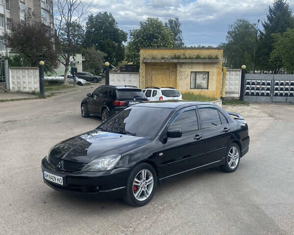 Чорний Міцубісі Lancer, об'ємом двигуна 2 л та пробігом 183 тис. км за 4500 $, фото 26 на Automoto.ua