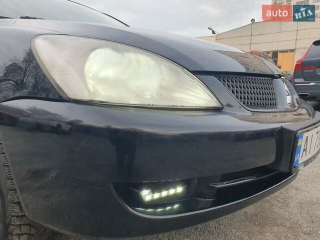 Черный Мицубиси Лансер, объемом двигателя 1.58 л и пробегом 222 тыс. км за 2999 $, фото 3 на Automoto.ua