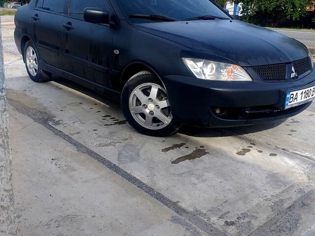 Чорний Міцубісі Lancer, об'ємом двигуна 1.6 л та пробігом 211 тис. км за 3500 $, фото 2 на Automoto.ua