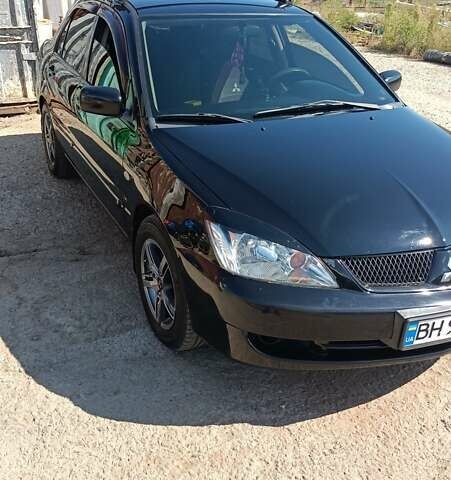 Черный Мицубиси Лансер, объемом двигателя 1.6 л и пробегом 257 тыс. км за 4500 $, фото 13 на Automoto.ua