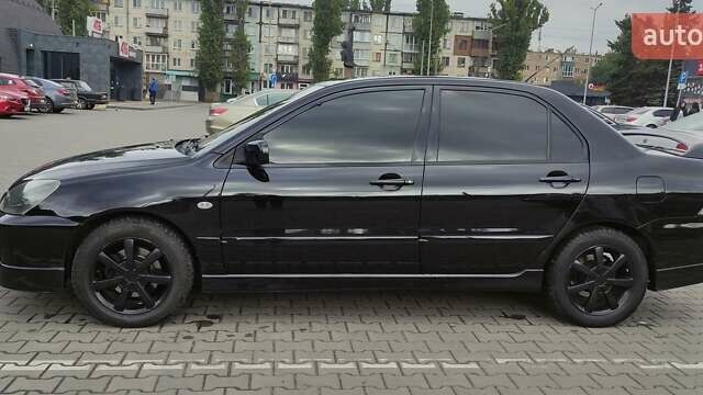 Черный Мицубиси Лансер, объемом двигателя 2 л и пробегом 181 тыс. км за 5500 $, фото 2 на Automoto.ua
