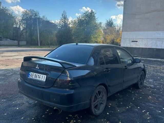 Черный Мицубиси Лансер, объемом двигателя 2 л и пробегом 200 тыс. км за 2999 $, фото 5 на Automoto.ua