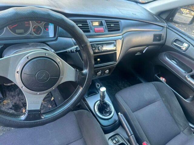 Черный Мицубиси Лансер, объемом двигателя 2 л и пробегом 200 тыс. км за 2999 $, фото 7 на Automoto.ua