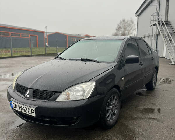 Черный Мицубиси Лансер, объемом двигателя 1.6 л и пробегом 368 тыс. км за 3200 $, фото 2 на Automoto.ua