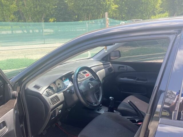 Чорний Міцубісі Lancer, об'ємом двигуна 1.6 л та пробігом 233 тис. км за 5000 $, фото 3 на Automoto.ua