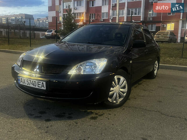Черный Мицубиси Лансер, объемом двигателя 1.6 л и пробегом 175 тыс. км за 4000 $, фото 9 на Automoto.ua