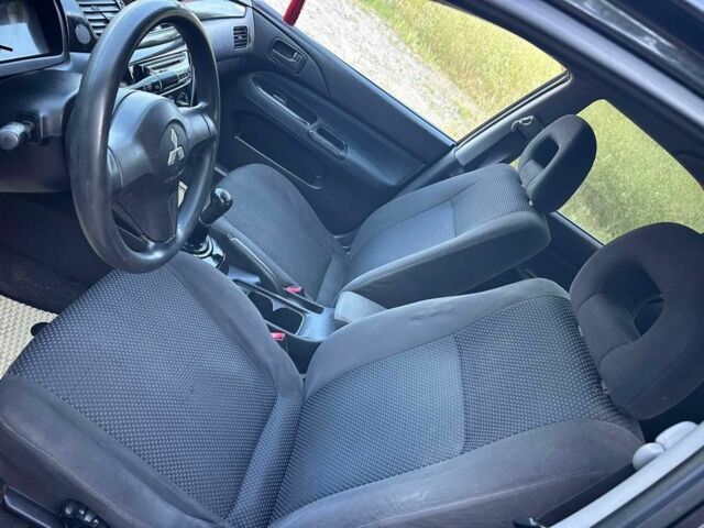 Черный Мицубиси Лансер, объемом двигателя 1.6 л и пробегом 289 тыс. км за 3200 $, фото 10 на Automoto.ua