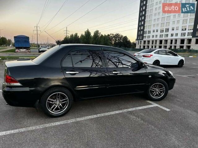 Чорний Міцубісі Lancer, об'ємом двигуна 1.58 л та пробігом 329 тис. км за 3500 $, фото 2 на Automoto.ua