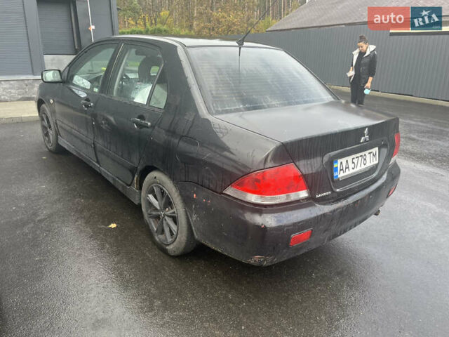 Чорний Міцубісі Lancer, об'ємом двигуна 1.58 л та пробігом 257 тис. км за 2400 $, фото 1 на Automoto.ua