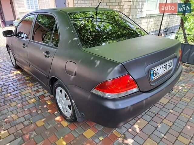 Чорний Міцубісі Lancer, об'ємом двигуна 1.58 л та пробігом 280 тис. км за 3950 $, фото 5 на Automoto.ua